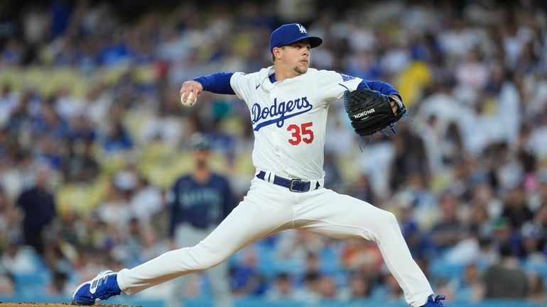 Los Angeles Dodgers pitcher Gavin Stone throws to a Los...