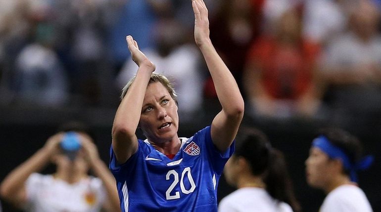 Abby Wambach #20 of the United States reacts after walking...