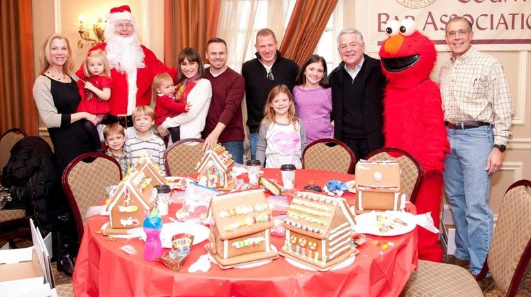 Attorney John P. McEntee plays Santa Claus at the Nassau...