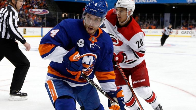 Thomas Hickey #4 of the New York Islanders skates against...