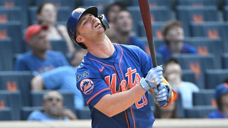 Mets first baseman Pete Alonso reacts as he pops out...