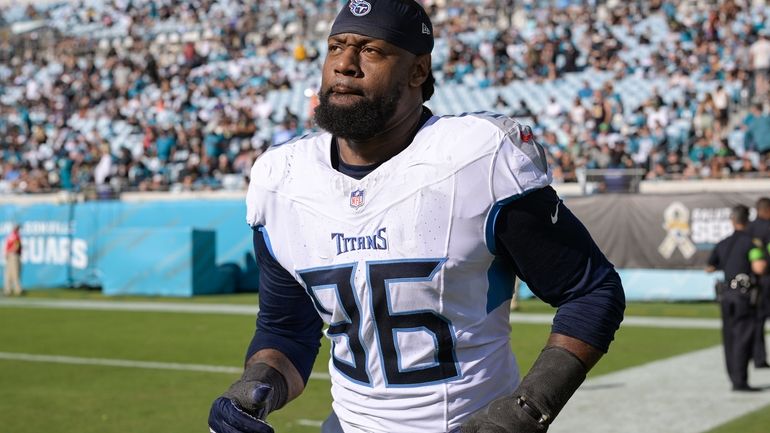 Tennessee Titans defensive end Denico Autry (96) runs onto the...