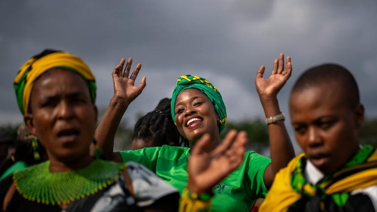 Supporters of Ukhonto weSizwe party dance during an election meeting...