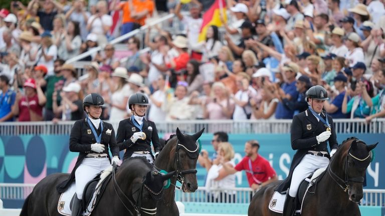 Team Germany, from left to right, Isabell Werth, riding Wendy,...