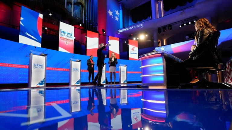 Stand-ins assume positions of candidates and moderators to check sound...