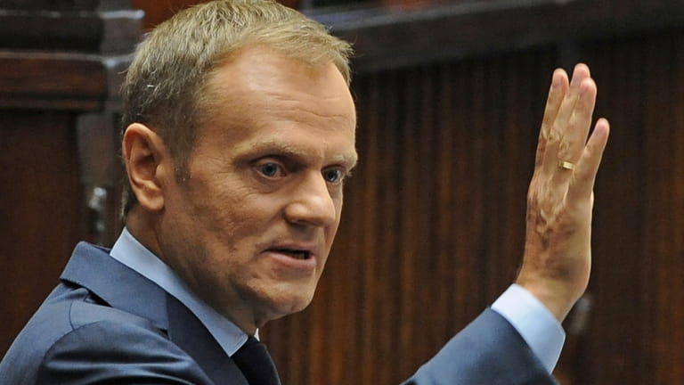 Polish Prime Minister Donald Tusk addresses lawmakers during a special...