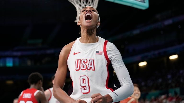 A'ja Wilson, of the Unites States, celebrates after scoring against...