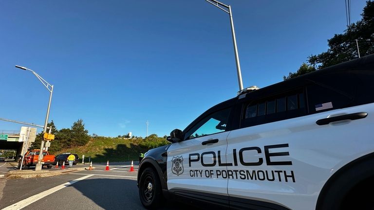 Police block a ramp to Interstate 95 and the Piscataqua...