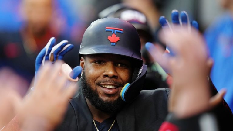 Toronto Blue Jays' Vladimir Guerrero Jr. (27) celebrates his solo...