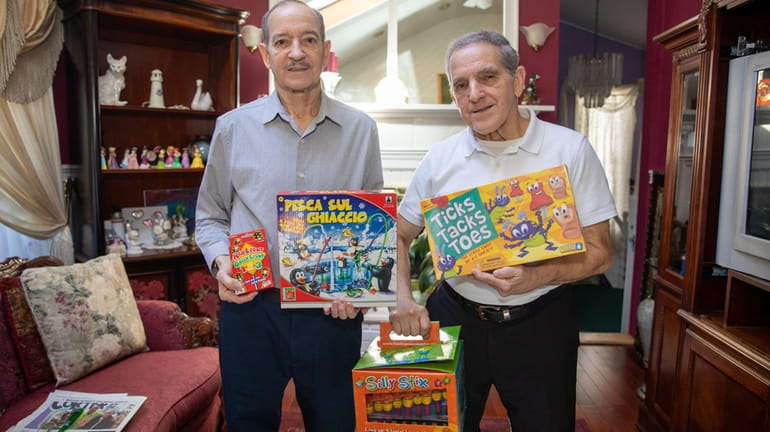From left, brothers Nick and Fred Acosta hold some of...