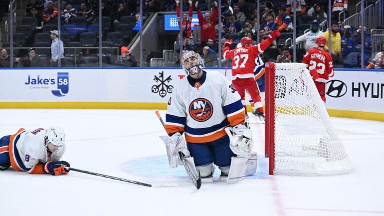 ]New York Islanders goaltender Ilya Sorokin and defenseman Noah Dobson...