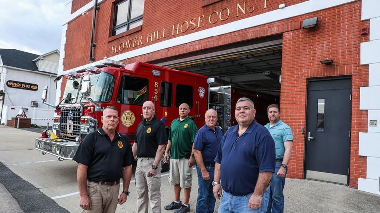 Port Washington Fire Department members, from left, Patrick Saccoccia, Matthew...