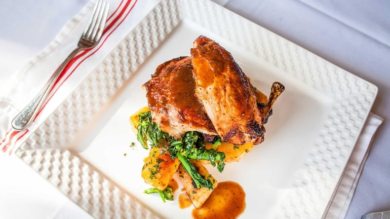 Juicy roasted chicken is a classic main course served at...