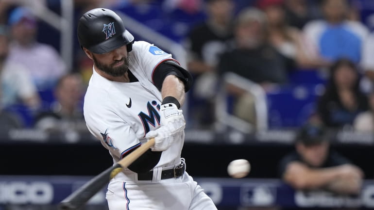 Miami Marlins first baseman Yuli Gurriel (10) swings at the pitch in an MLB  baseball game