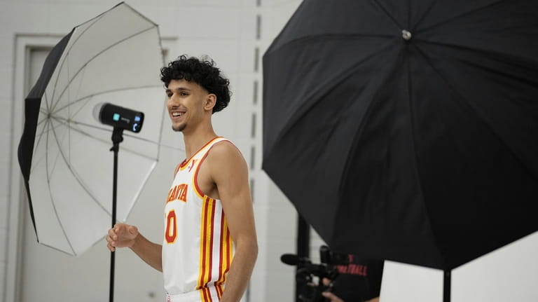 Atlanta Hawks' Zaccharie Risacher poses for a photograph after a...
