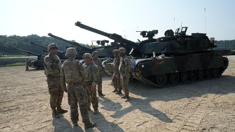 U.S. Army soldiers from the 1st Armored Brigade Combat Team...