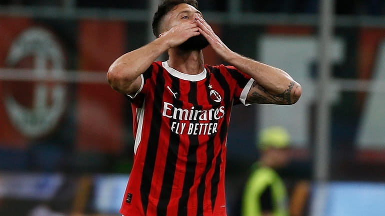 Milan's Olivier Giroud celebrates after scoring a goal during the...