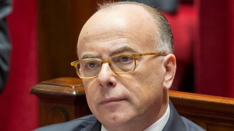 French Prime Minister Bernard Cazeneuve listens during a session at...