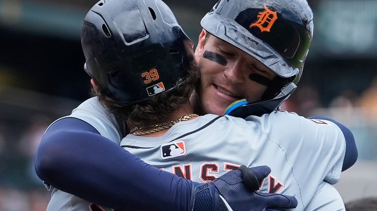 Detroit Tigers' Dillon Dingler, right, celebrates with Zach McKinstry after...