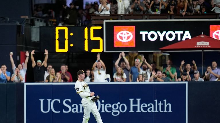 San Diego Padres center fielder Jackson Merrill celebrates after making...