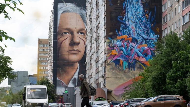 A mural showing WikiLeaks founder Julian Assange is seen on...