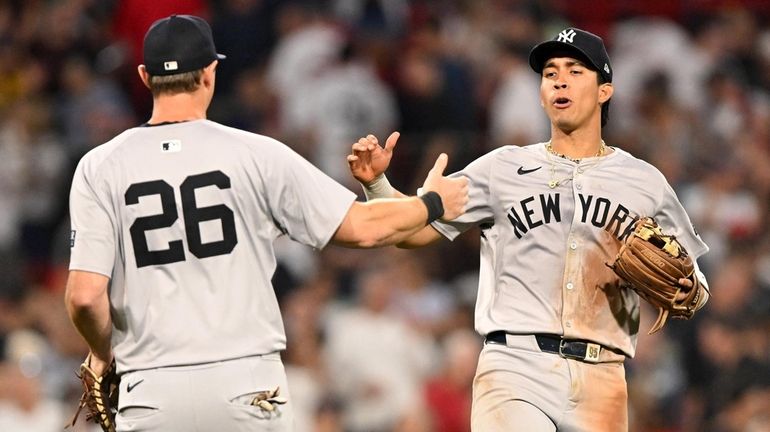 Oswaldo Cabrera of the Yankees celebrates with DJ LeMahieu after...