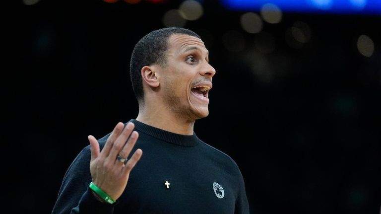 Boston Celtics head coach Joe Mazzulla shouts from the bench...