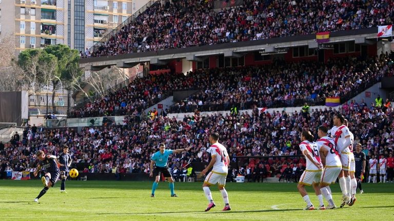 Real Madrid's Toni Kroos, left, makes an attempt to score...