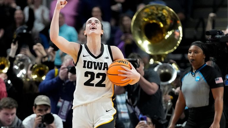 Iowa guard Caitlin Clark (22) celebrates after defeating LSU in...