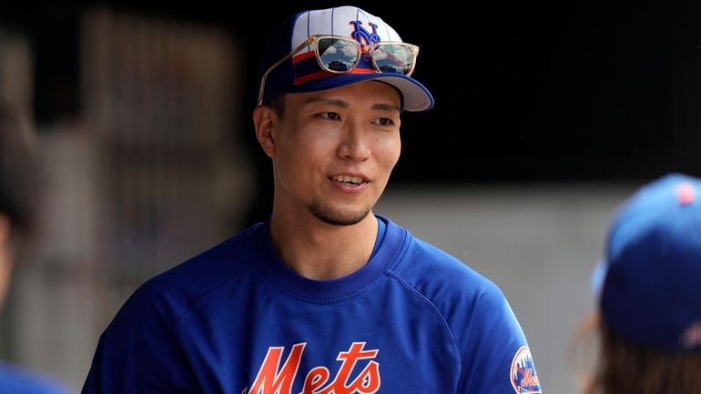 Mets pitcher Kodai Senga responds to questions during an interview...