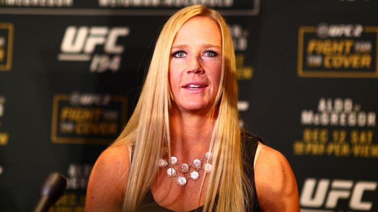 Holly Holm answers questions from the media during UFC media...