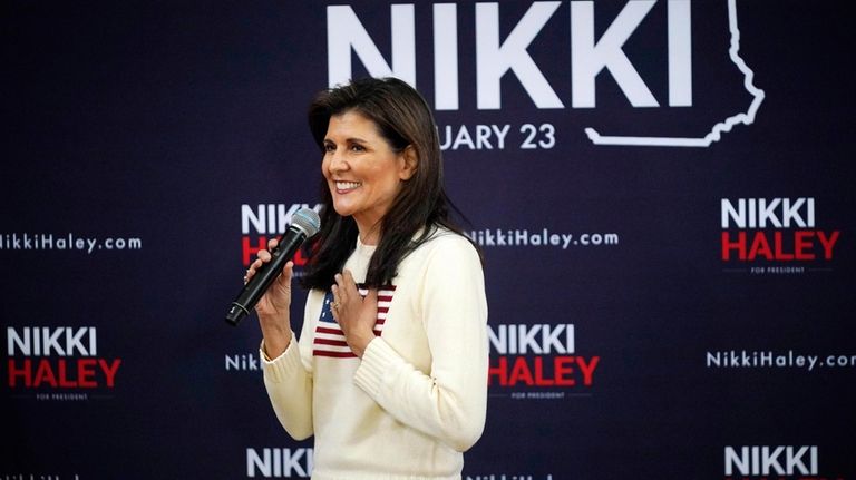 Republican presidential candidate former UN Ambassador Nikki Haley acknowledges her...