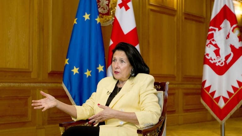 Georgian President Salome Zourabichvili gestures while speaking during an interview...