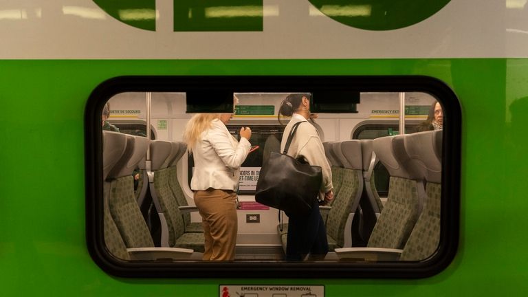 Commuters arrive at Union Station on a GO Train as...