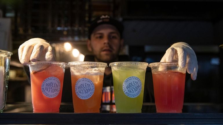 Cocktails-to-go for sale at Dudley's bar and restaurant in Manhattan...