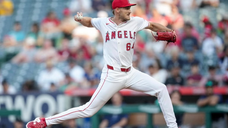 Los Angeles Angels starting pitcher Jack Kochanowicz (64) throws during...