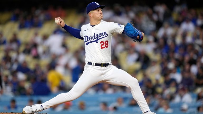 Los Angeles Dodgers starting pitcher Bobby Miller throws to the...