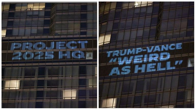 The Democratic National Committee projected signs on Trump International Hotel...