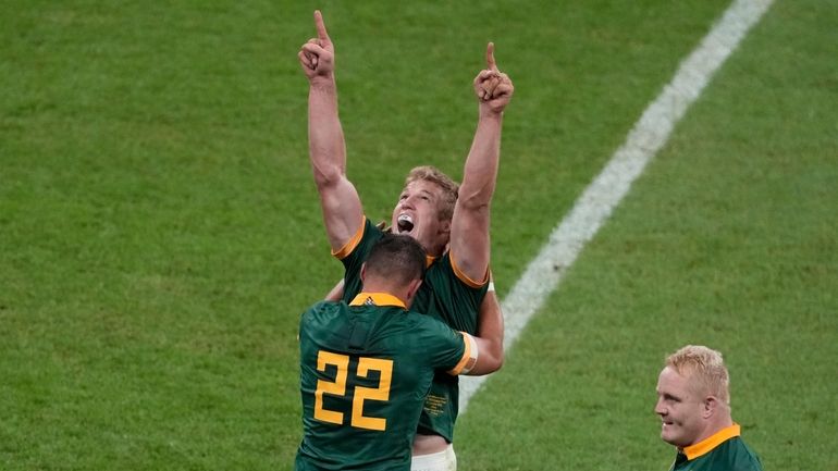 South Africa's team players celebrate as they won the Rugby...