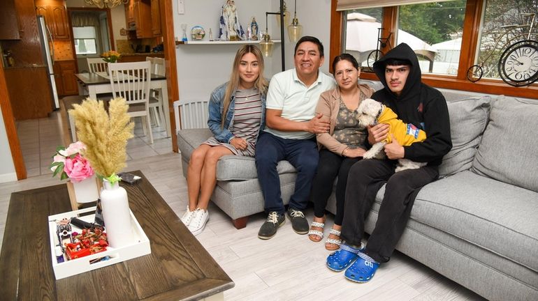 The Rios family in the living room of their Lindenhurst...