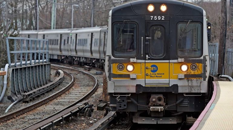 A westbound train pulls out of the Huntington Long Island...