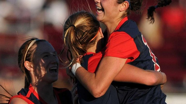 South Side's Juliana Pellegrini, right, gets congratulated by teammates after...