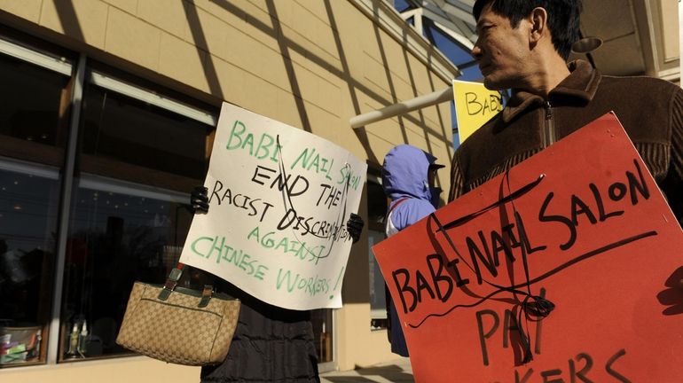 Chinese nail salon workers, protest outside Babi Nail Salon in...