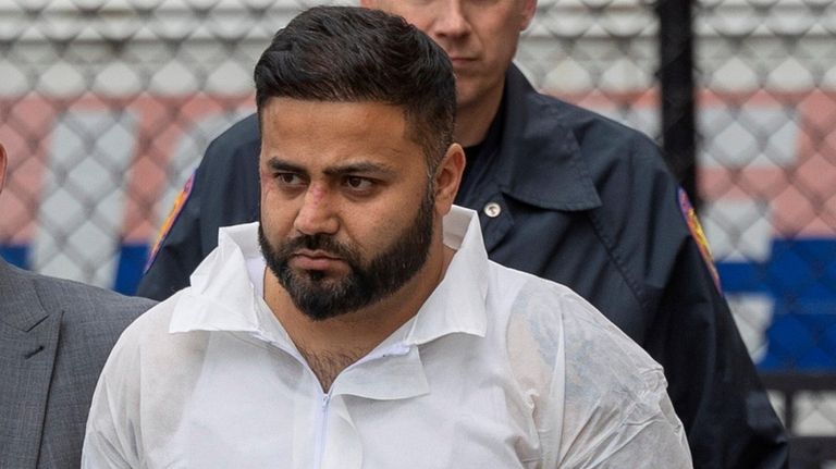 Amandeep Singh, 34, of Roslyn, leaves Nassau Police headquarters in...