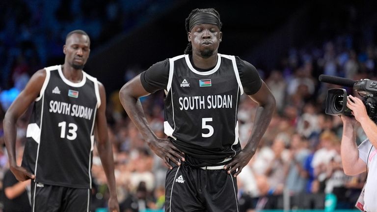 South Sudan's Nuni Omot, right, and South Sudan's Majok Deng...