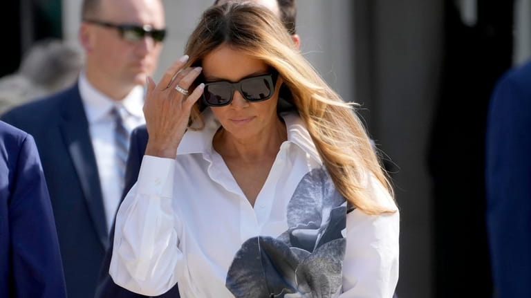 Former first lady Melania Trump leaves after voting in the...