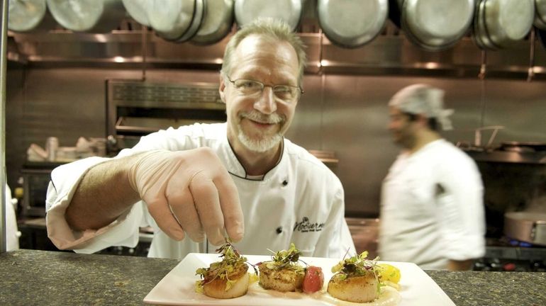 Nocturne executive chef and owner Mark Hrisho finishes an order...