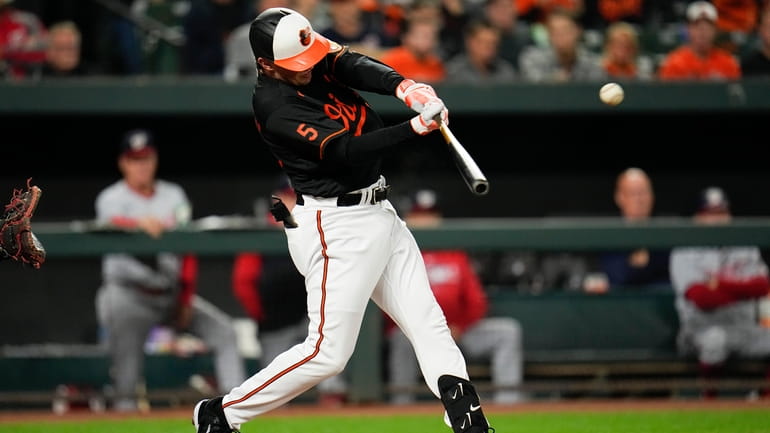 Baltimore Orioles' Adley Rutschman connects for a two-run home run...