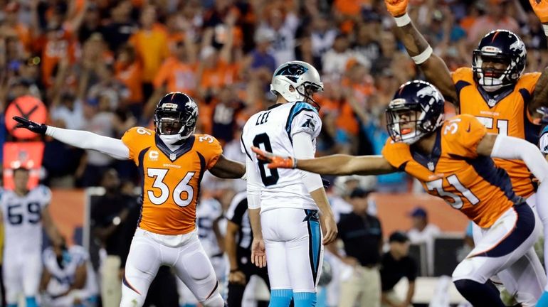 Denver Broncos cornerback Kayvon Webster (36) celebrates Carolina Panthers punter...