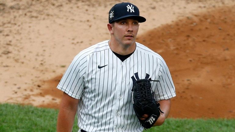 Chad Green of the Yankees walks to the dugout after the...